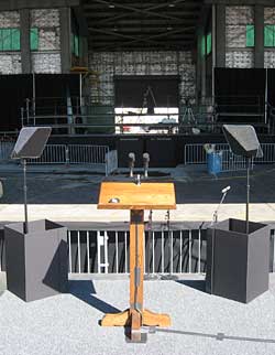 This a presidential prompter on-site at a political rally. The event was held at an airport using an airplane hanger as shelter for the audience.